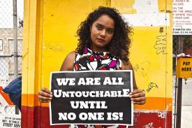 woman with poster: we are all untouchable until no one is!