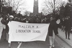 Black students leave the campus after vacating the Allen Administration Building in the wake of its takeover to protest the campus racial climate. Photograph by Harold Moore, courtesy of The Herald-Sun