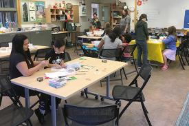 Families learning in Duke Gardens' classroom