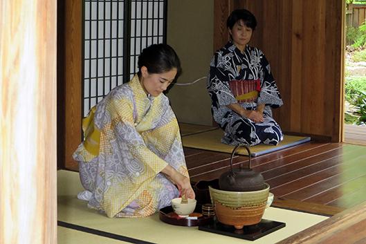 Japanese tea practitioners preparing tea at Duke Gardens.