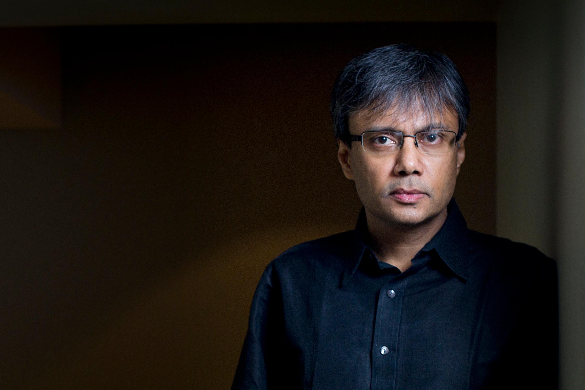 Image of Amit Chaudhuri leaning in a doorway