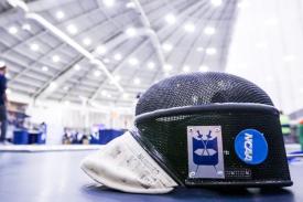 Duke fencing mask with competition in background