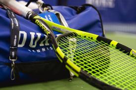 tennis racket and Duke duffle bag