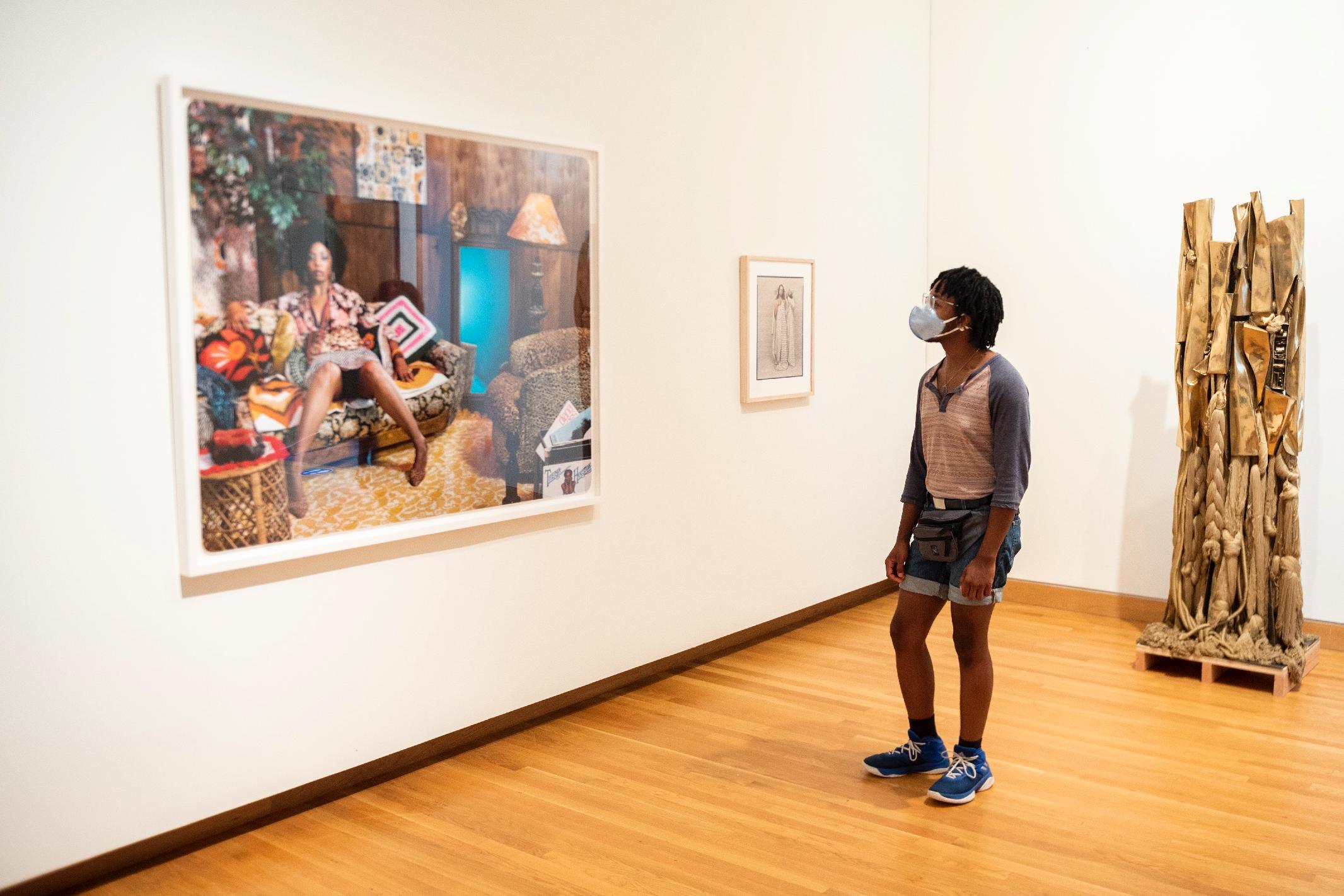 Visitor takes in new exhi bition at the Nasher