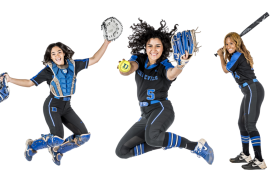Two softball players jumping in air, third player posed to bat