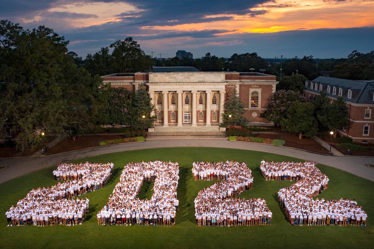 first year students standing in class year 2022 formation on East Campus Quad