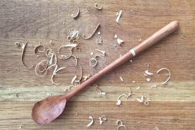 wooden spoon with wood shavings