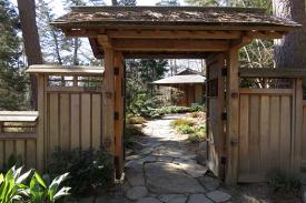 A wooden archway that leads to the Duke Gardens teahouse.