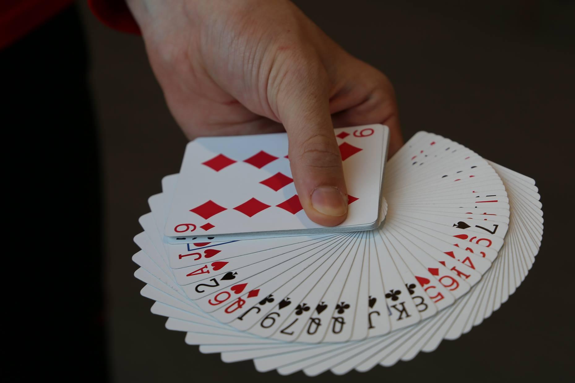 Hand holding a deck of cards