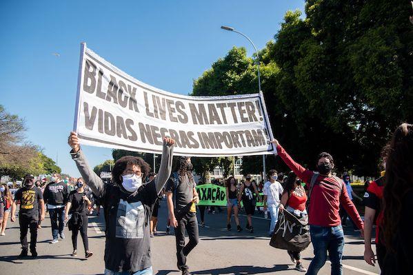 BLM prosters holding signs