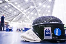 Duke fencing mask with competition in background