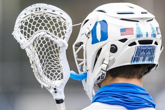 player holding lacrosse stick player holding lacrosse stick