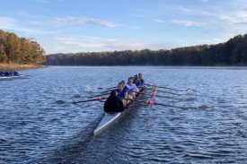 Womens rowing team in water Womens rowing team in water