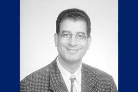 Black and white headshot of seminar speaker, Dr. David Sheikh-Hamad, smiling and wearing glasses and a checkered suit jacket. Black and white headshot of seminar speaker, Dr. David Sheikh-Hamad, smiling and wearing glasses and a checkered suit jacket.