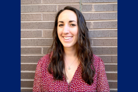 Seminar speaker, Paige Varner, smiling, wearing a red shirt, and standing in front of a brick wall. Seminar speaker, Paige Varner, smiling, wearing a red shirt, and standing in front of a brick wall.