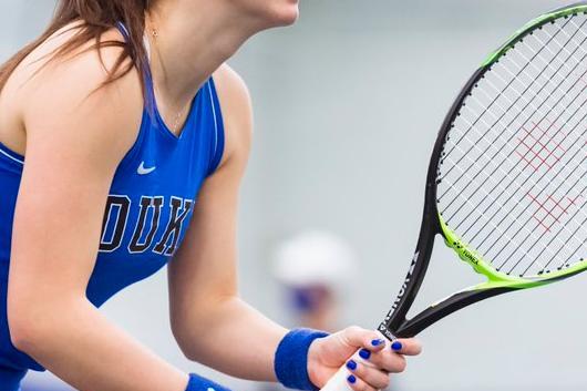 Woman tennis player holding tennis racket