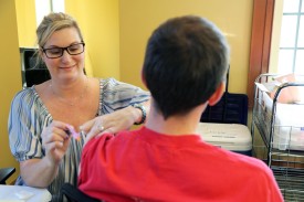 Nurse giving a student a flu vaccination
