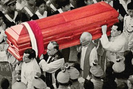 a black and white photo of Guatemalans carrying the casket of Bishop Juan Gerardi