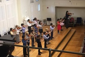 Violin Choir playing in the Nelson Music Room