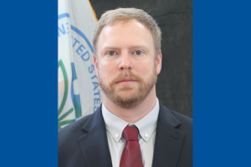 Seminar speaker, Dr. Joshua Harrill, standing in front of US EPA flag. Seminar speaker, Dr. Joshua Harrill, standing in front of US EPA flag.