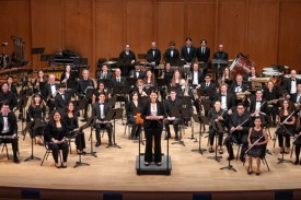 The Duke University Wind Symphony onstage in Baldwin Auditorium