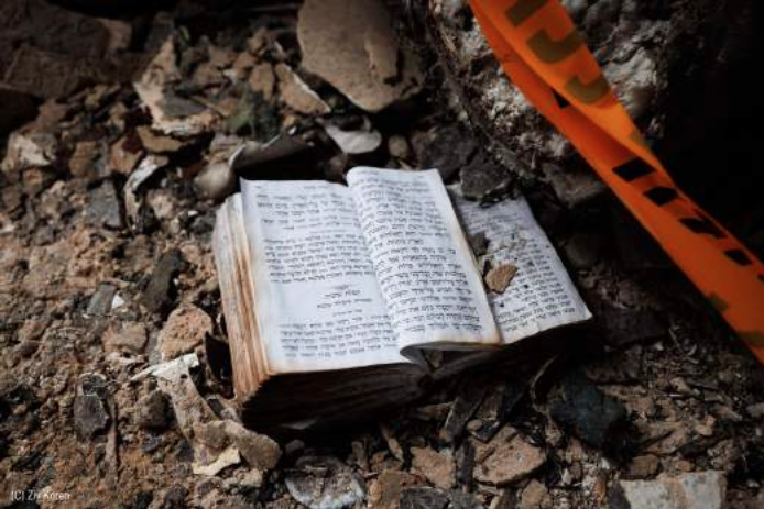 a prayerbook in rubble