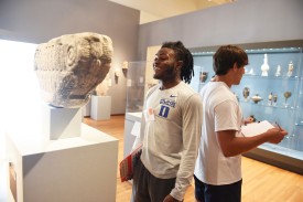 Duke Student football players describe art to one another during our "Back to Back Drawing" activity