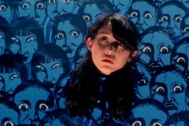 A girl&#39;s head floats against a cartoon background of anguished faces in a still from House