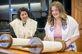 Duke student reads the Torah scroll at the Freeman Center