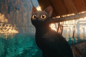 A gray black animated cat sits in a boat in a still from Flow