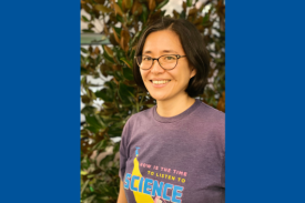 Seminar speaker, Eri Saikawa, wearing a shirt that says &quot;Now is the time to listen to science&quot;