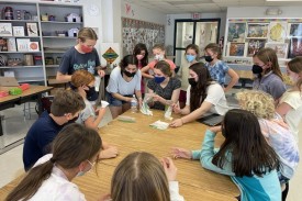 FEMMES+ participants working on an activity in a classroom