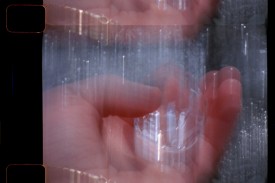 film still shows hand holding melting ice
